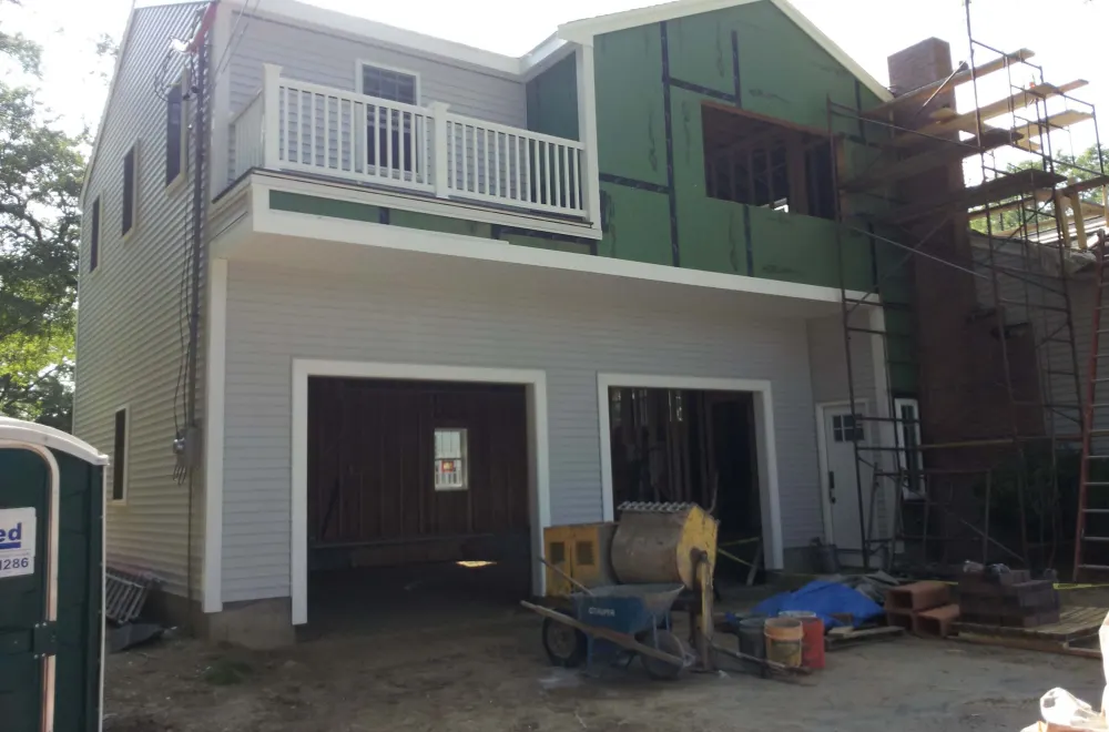Two-story addition under construction with scaffolding